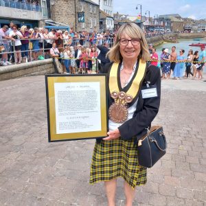 Liz Carne with proclamation of accession in Kernewek presented to King Charles in St Ives